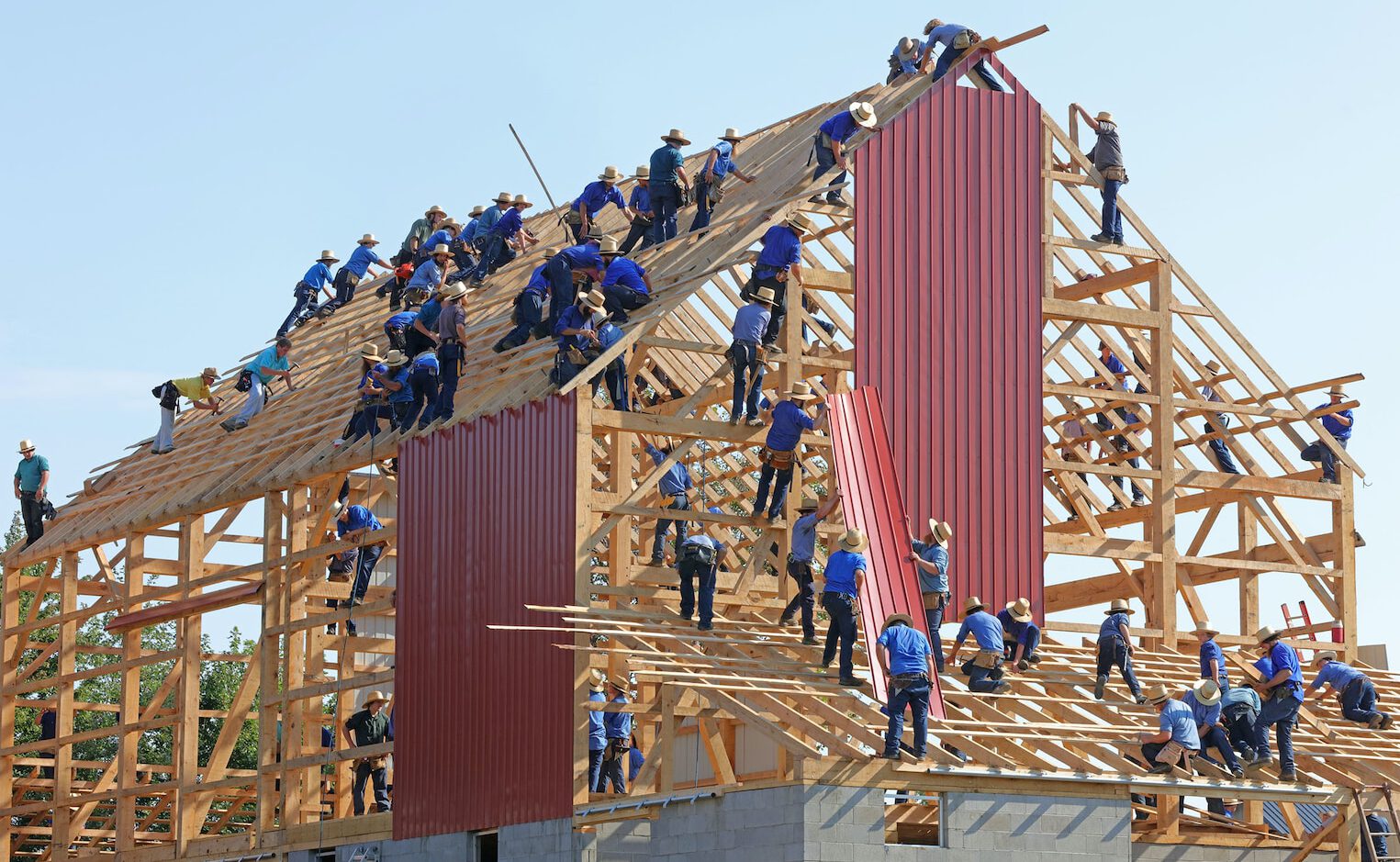 people building structure during daytime